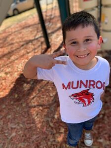 Youngest Guerrero child making a peace sign with his fingers